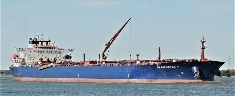 Crude oil carrier Seamaster IV navigating in a channel channel while using her manifold crane.