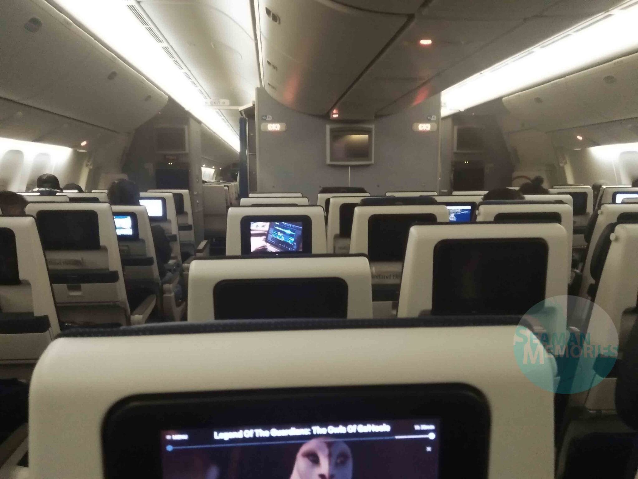 Inside the aircraft with only few passengers but with so many empty seats.