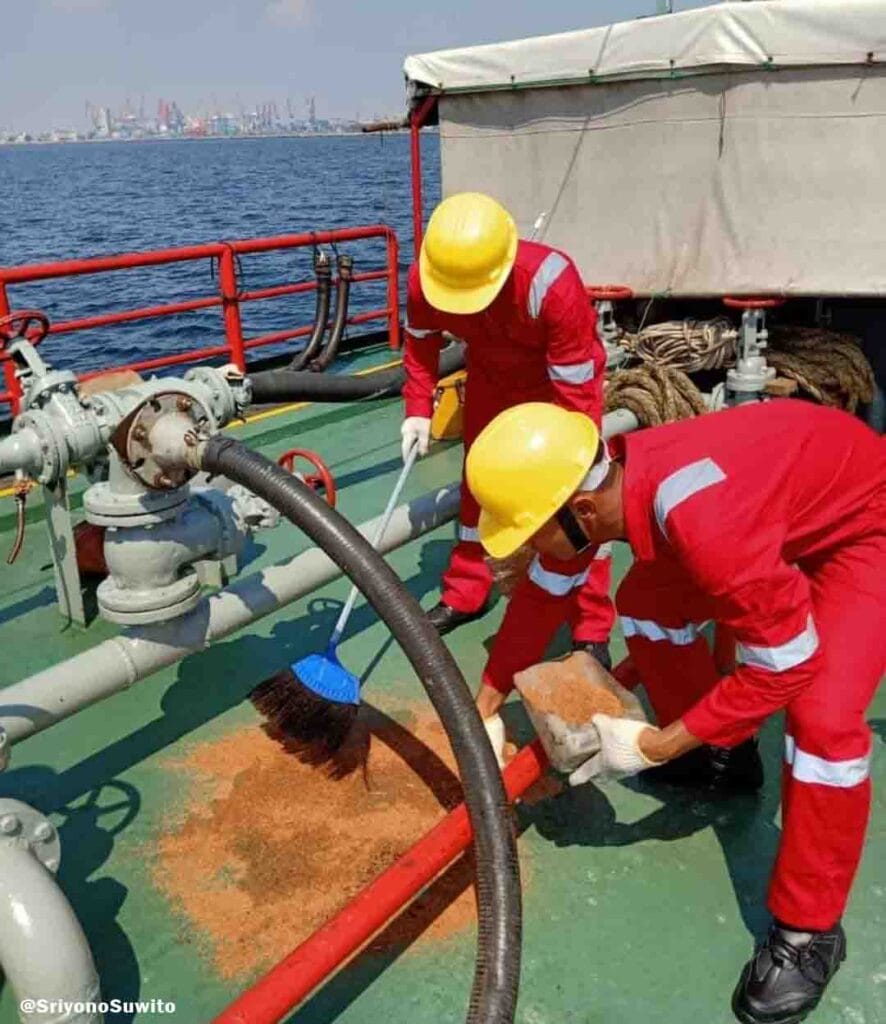 Oil spill drill wherein the crew with proper PPE use sawdust to mitigate the oil spill on deck.