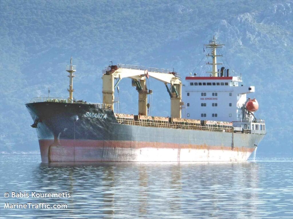 Bulk carrier Smarta at the anchorage on a very calm sea.