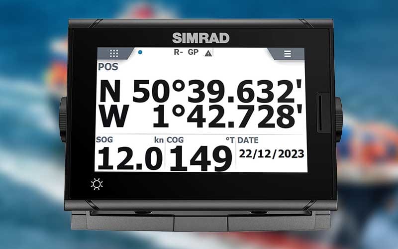 A marine GPS receiver showing the vessel's current position in latitude and longitude.