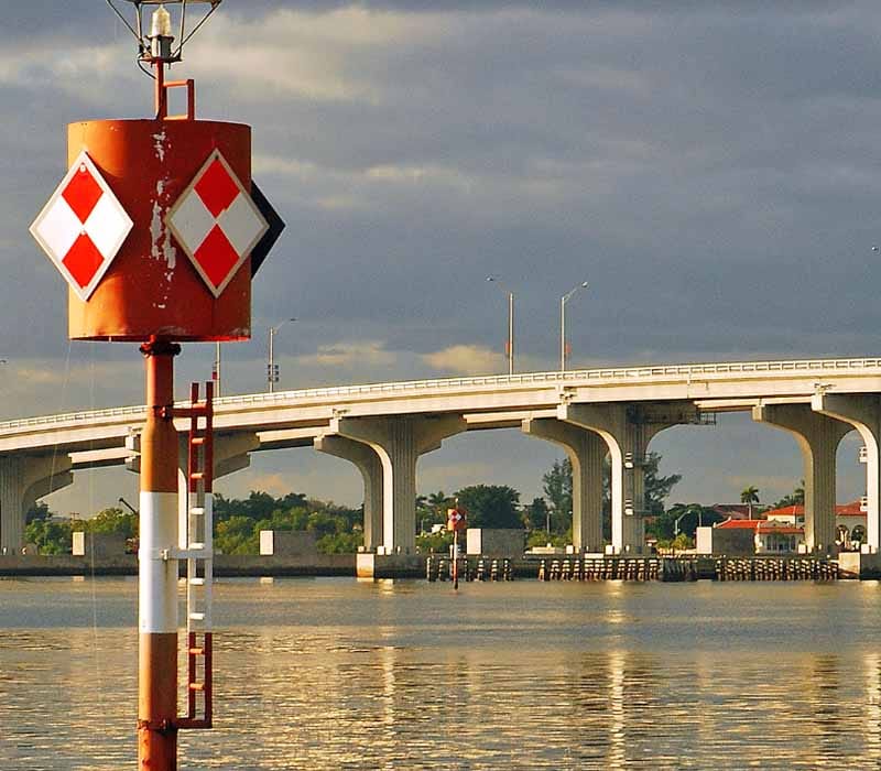 A typical diamond-shaped dayboard with red-white colors.