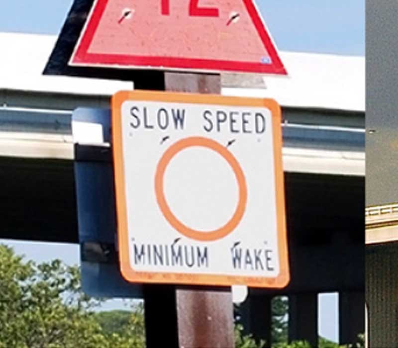 An Information/ Regulatory Mark that tells the ships passing by to reduce speed so as to create small wakes.